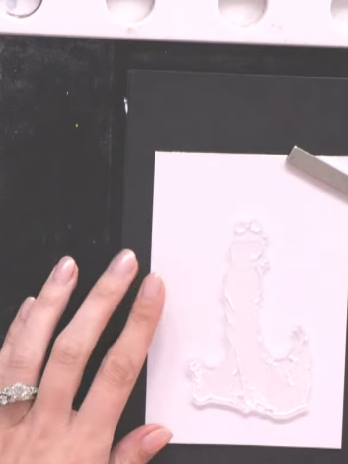 Step 3: Stamp the inked gown image onto your white card blank, positioning it centrally with space at the top for the 