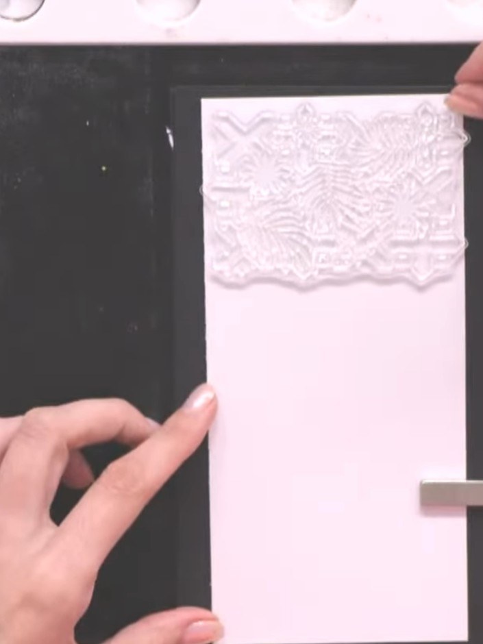 Step 2: Ink the Abstract Tiles stamp with Midnight hybrid ink. Position the stamp on the white card blank and press fi