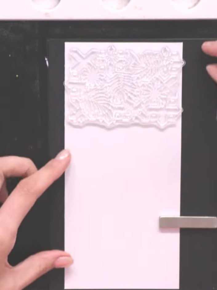 Step 3: Position the Abstract Tiles stamp centrally at the top of your white card panel. Ink the stamp with Midnight h