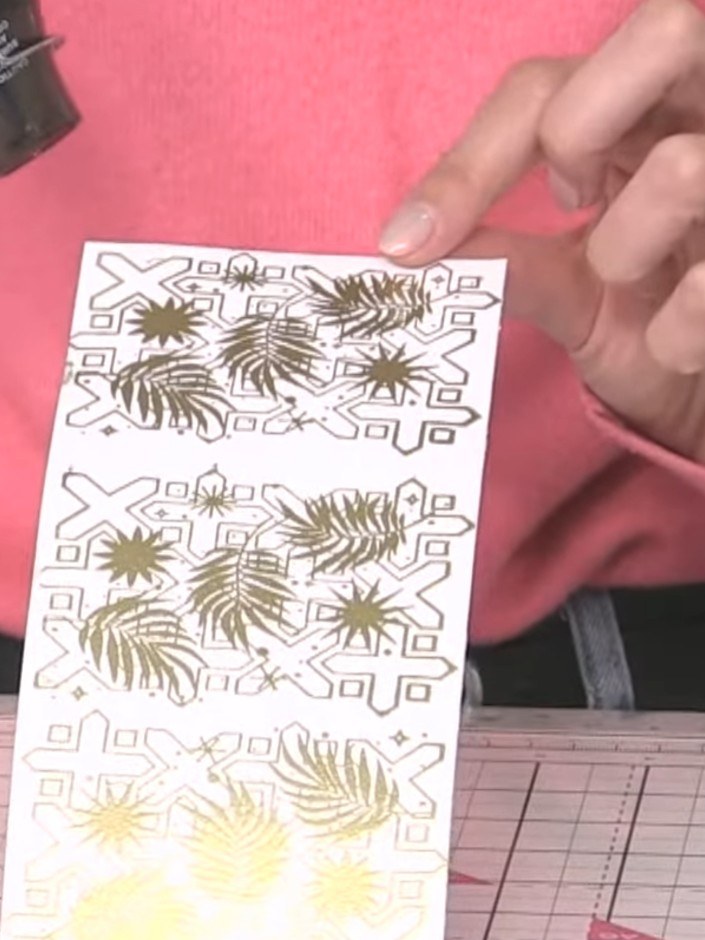 Step 9: Squeeze teal ink onto a ceramic mat and spray it with water to create a puddle.