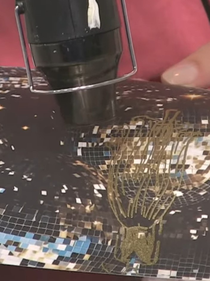 Step 10: Apply gold glitter glue along the dress lines and details to enhance the sparkle effect. Work carefully to fol
