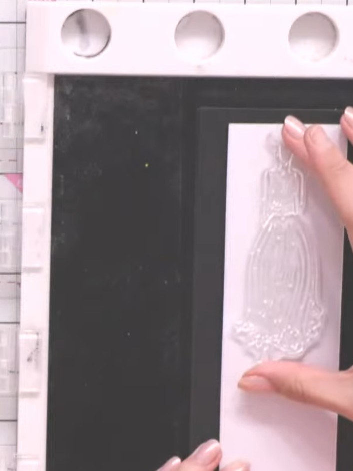 Step 4: Heat set the gold embossing powder with a heat gun, moving it over the stamped image until the powder melts an
