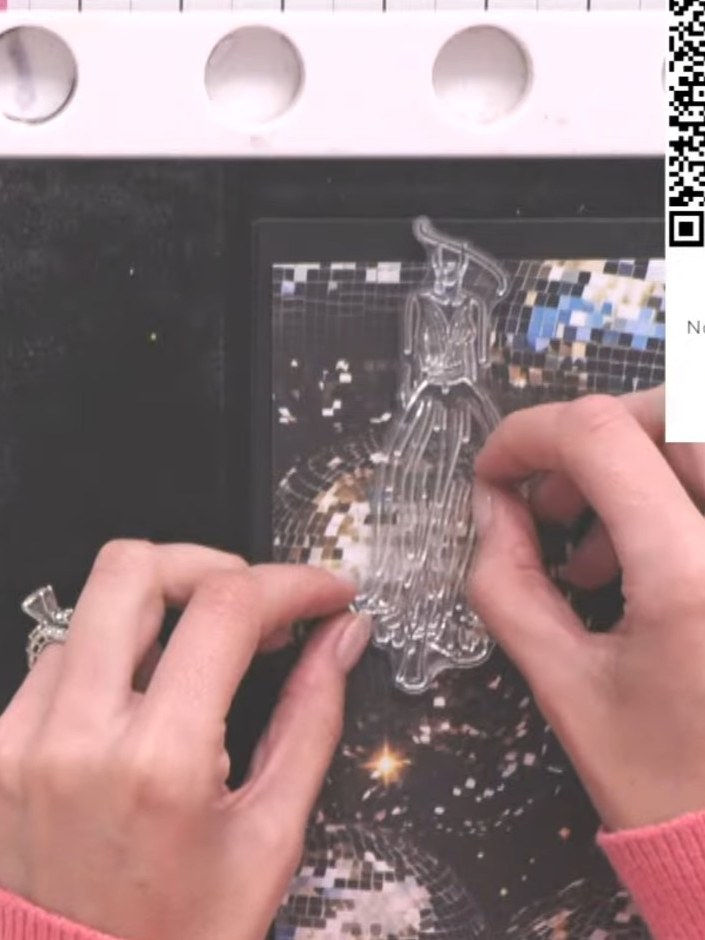 Step 5: Using scissors, carefully cut around the dress portion of the embossed gown, removing the head, arms, feet and