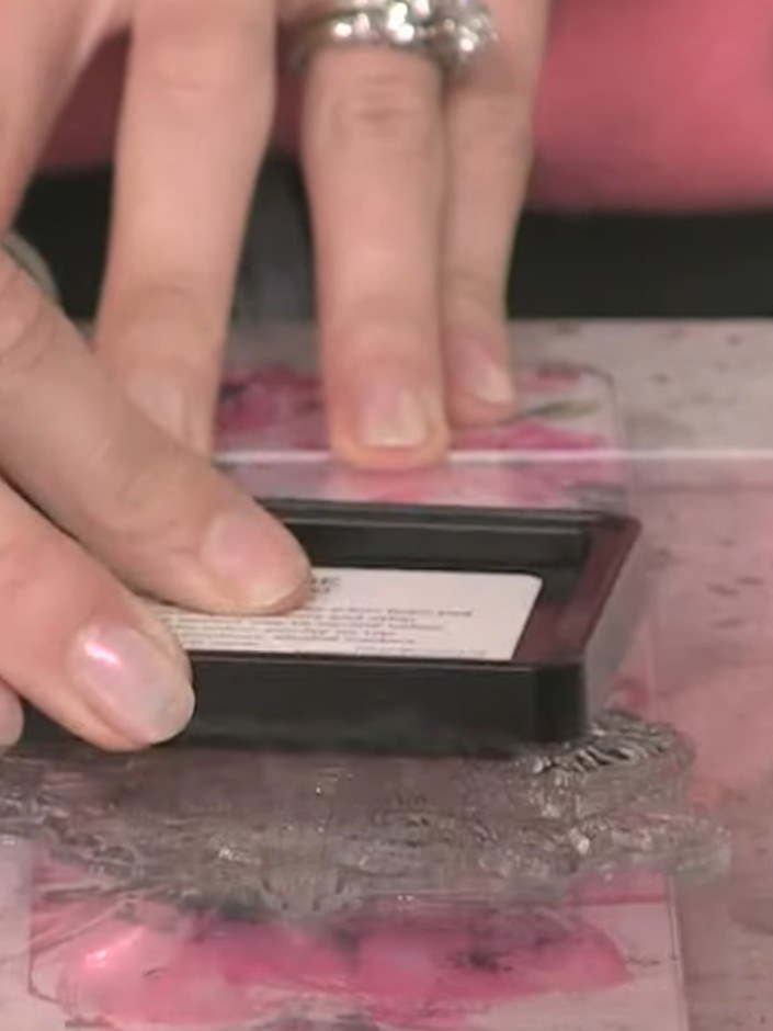 Step 5: Using a small brush, paint the watercolour into the flower petals, starting with one petal. Apply the colour c