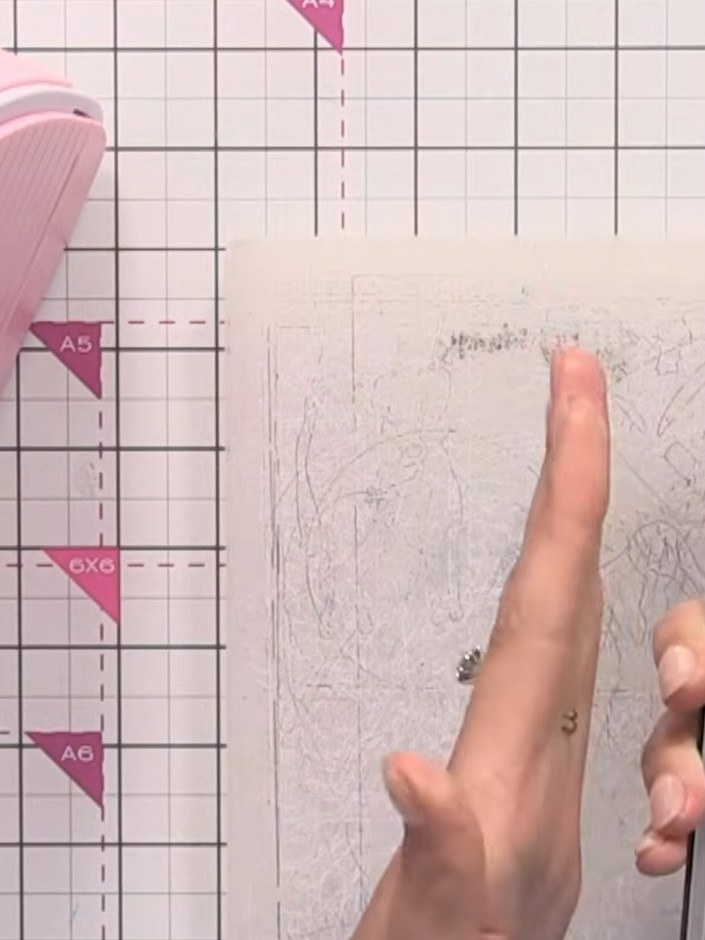 Step 2: Place the black card into the embossing folder with the floral design, ensuring it sits flat and centred withi