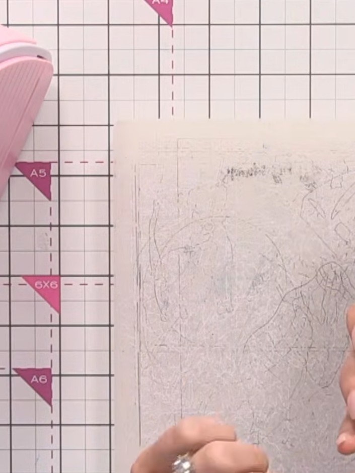 Step 3: Run the embossing folder with your card through your die-cutting machine to create the embossed floral detail.