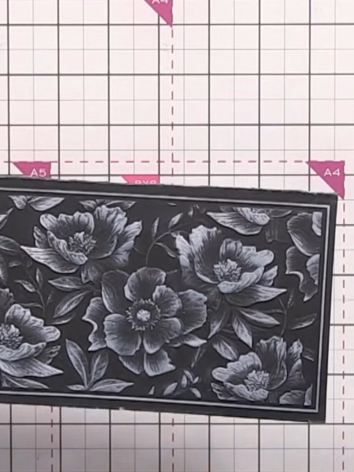 Step 2: Run the embossing folder with your card through your die-cutting machine to emboss the floral design onto the 