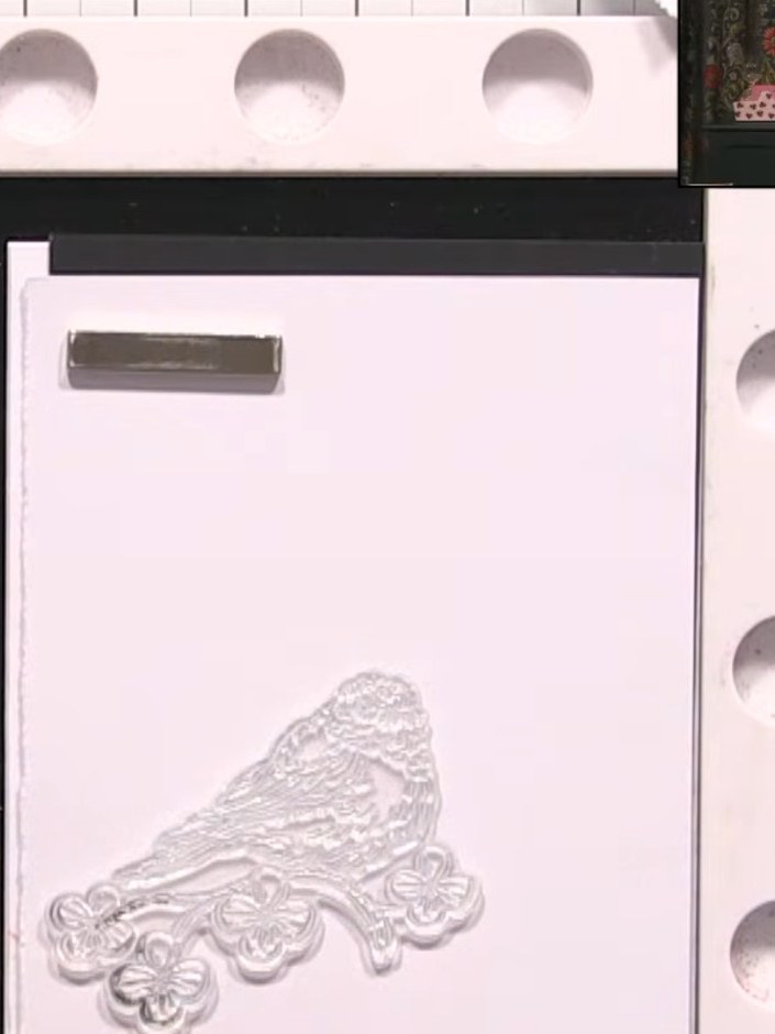 Step 1: Stamp the bird design onto white cardstock using black ink. Position the stamp carefully on the card and press