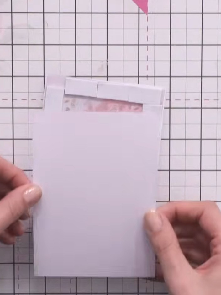 Step 7: Place the second aperture frame piece on top of the foam pad frame, aligning it carefully. Press down firmly a