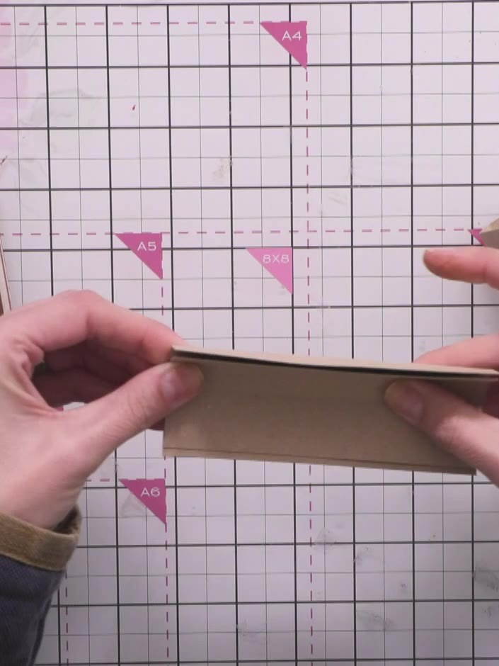 Step 10: Glue the hinge strips together, nesting them inside each other to create a cascading effect. Hold the pieces i
