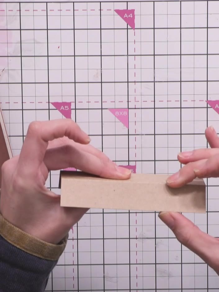 Step 11: Cut your page pieces to size, ensuring they fit within the album dimensions without exceeding the cover size. 