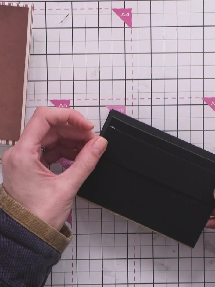 Step 12: Glue the completed hinge and page assembly into the centre of your album spine. Ensure everything is aligned a