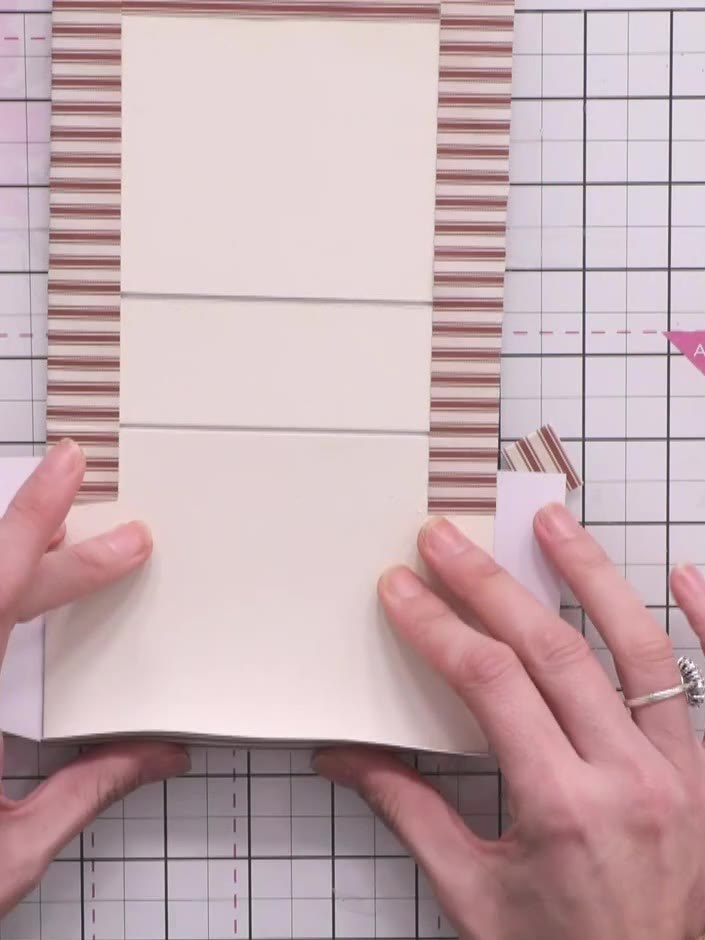Step 7: Apply glue to the wrapped paper edges inside the covers. Press down firmly to secure the paper and hide the mo