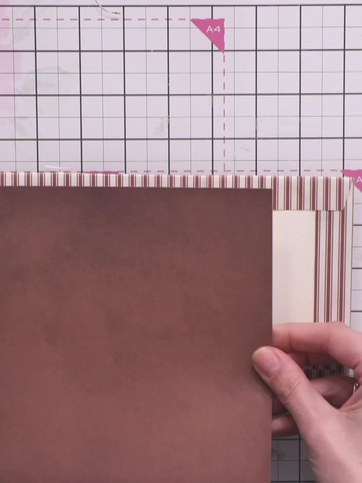 Step 8: Cut pieces of coordinating striped paper to fit the interior panels of your album. This will cover the structu