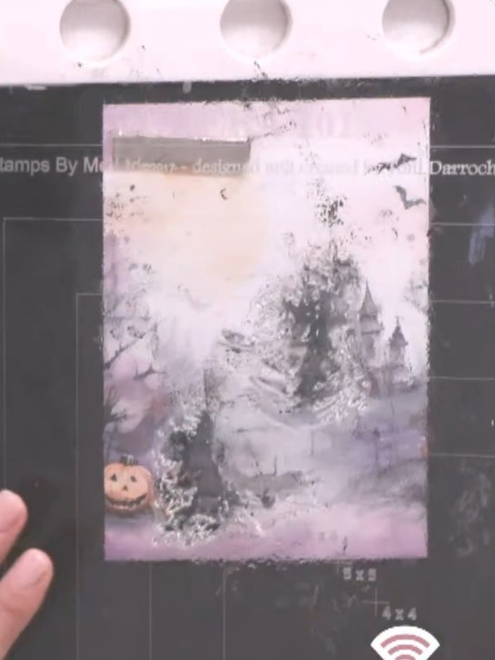Step 2: Ink up the coloured background portion of the witch stamp using oxide ink. Focus on the watercolour wash area 