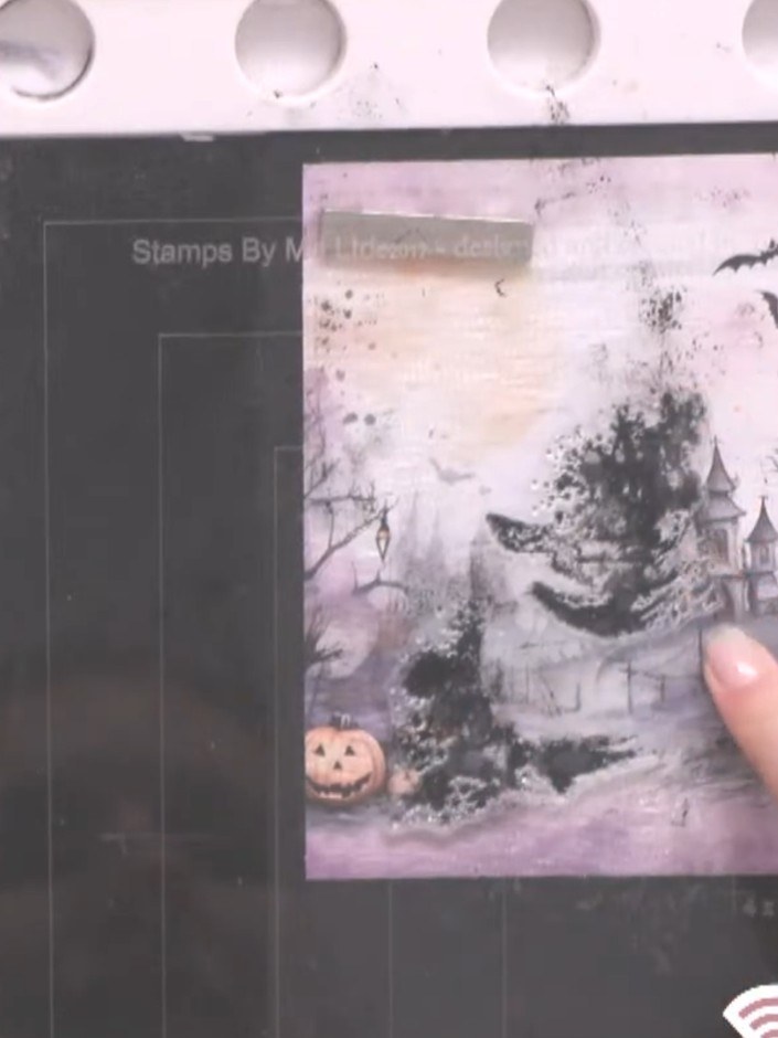 Step 4: Stamp the background wash image onto your paper to create a soft, smoky effect behind your scene. The wash cre