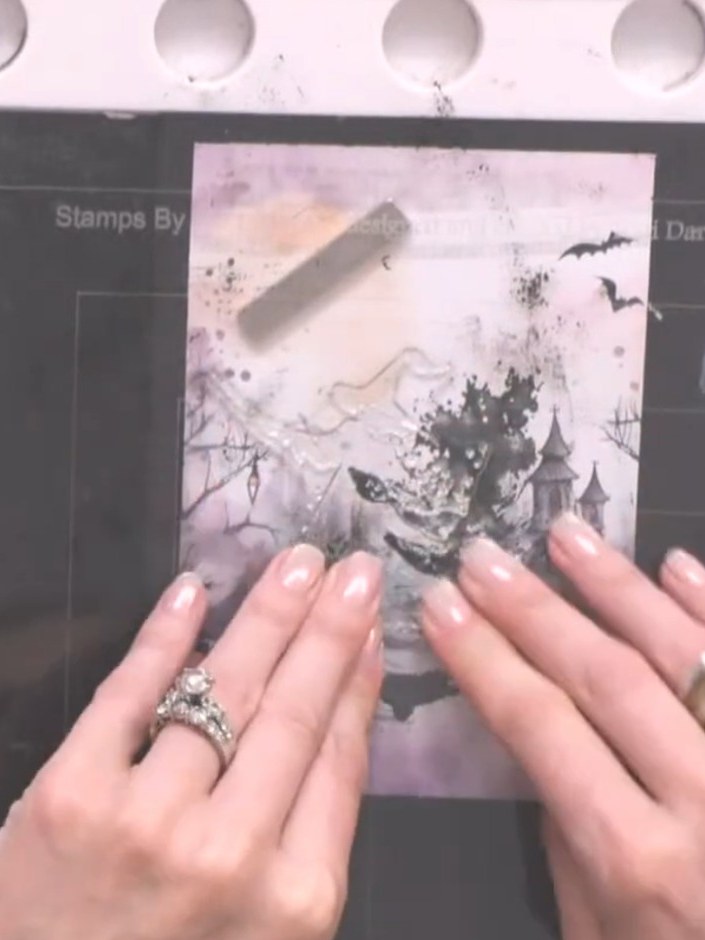 Step 9: Sprinkle gold embossing powder over the wet stamped image on your card. Ensure the powder covers all the inked