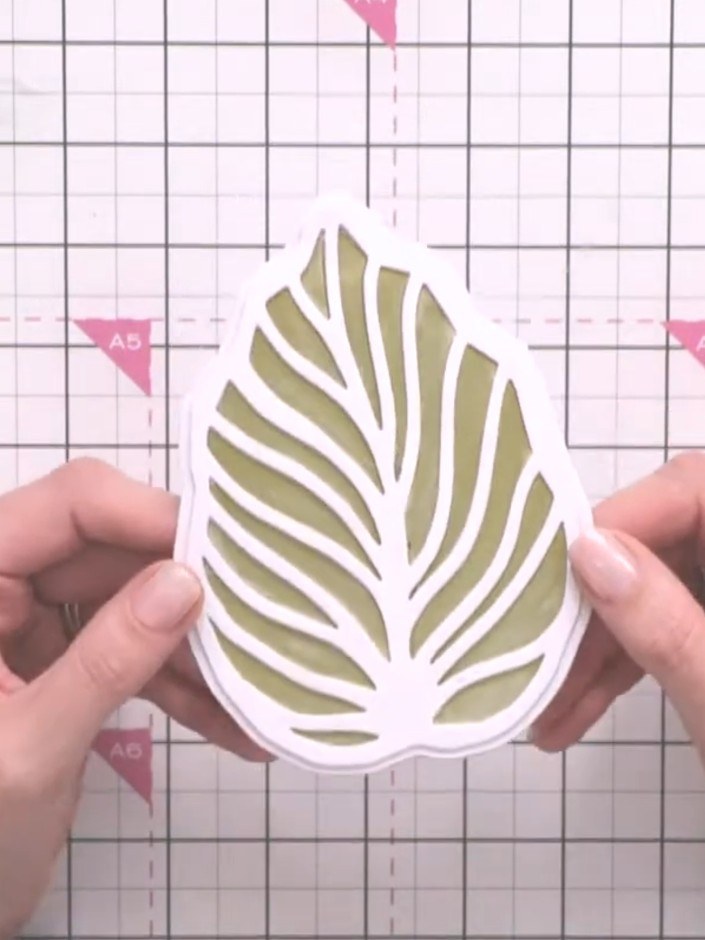 Step 10: Fussy cut flowers from the paper pad. Glue them to the card front as embellishments to complete your gold leaf