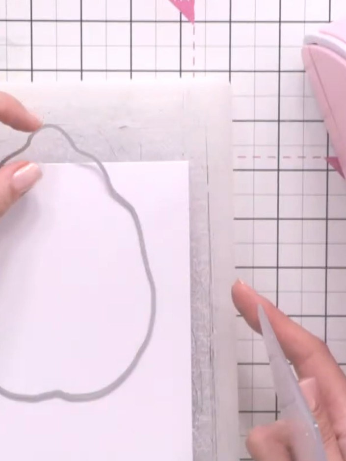 Step 2: Run the card and die through your die-cutting machine to cut the leaf shape while keeping the hinge intact at 
