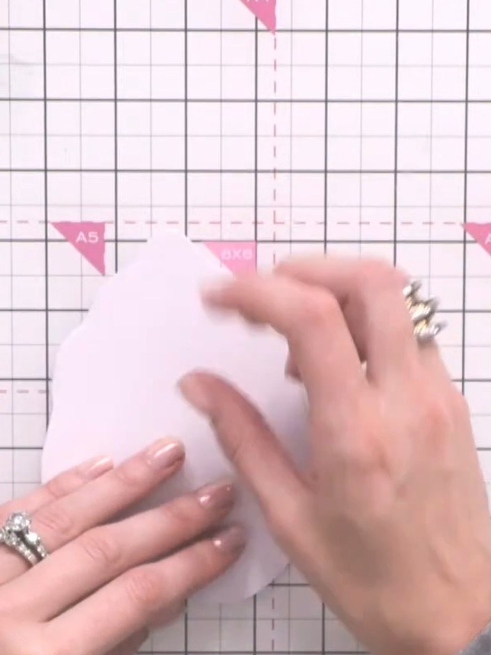 Step 4: Glue the complete white leaf shape directly on top of the hinged card front to create the full leaf outline. E