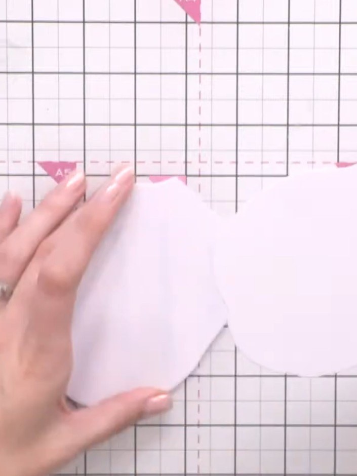 Step 5: Cut two or three additional leaf shapes from white card stock. Layer and glue them together to create a thick,