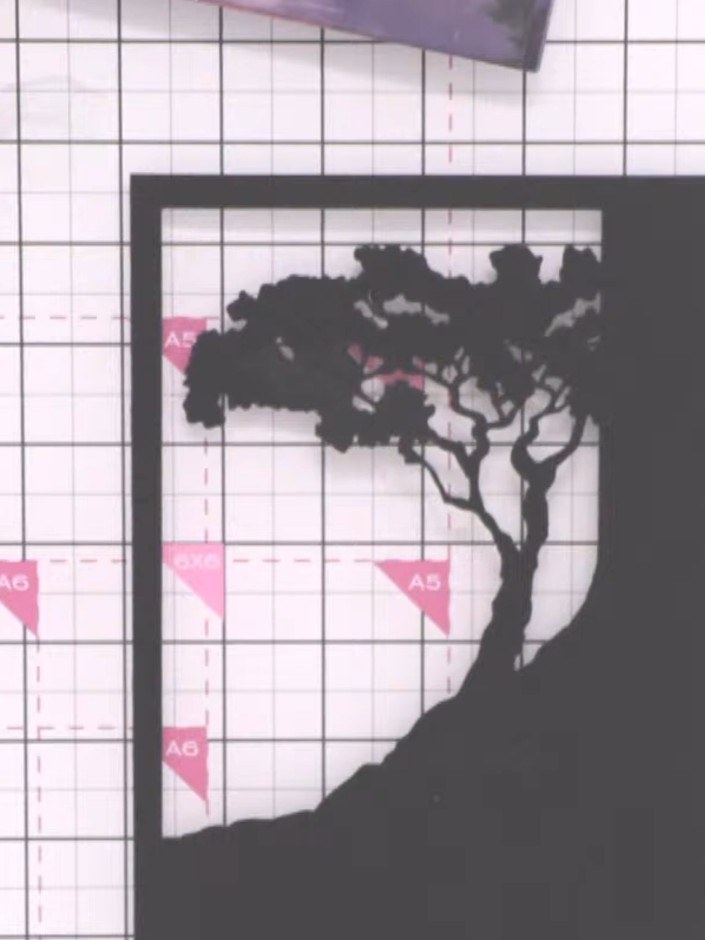 Step 3: Run the Moonlit Skies frame die through your die-cutting machine with black cardstock to create the decorative