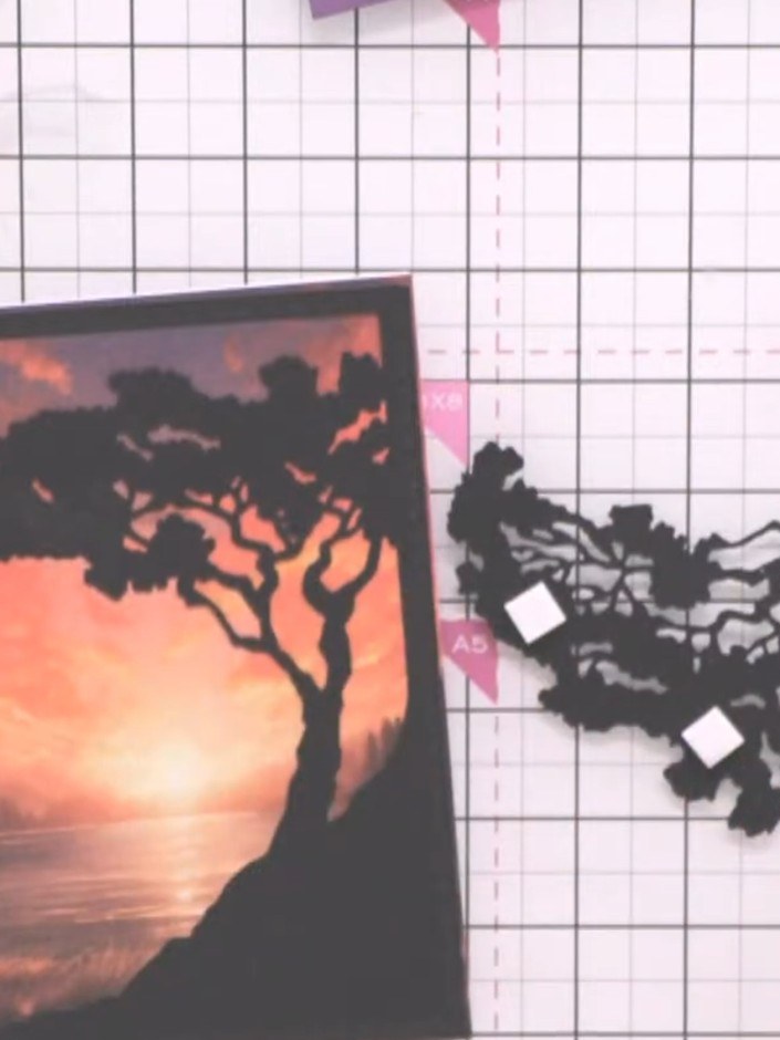 Step 7: Cut a second tree from black cardstock using the tree die. This will create a 3D layered element for your card
