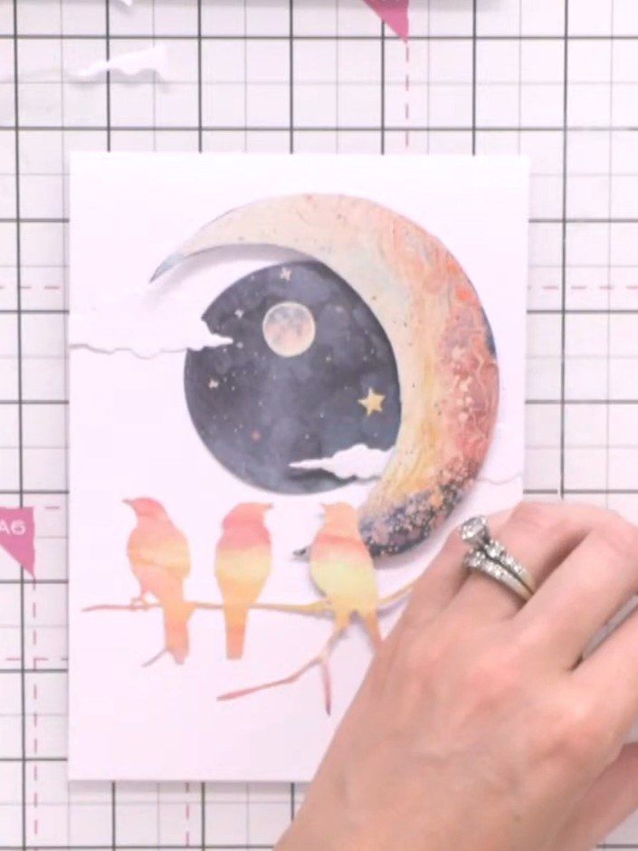 Step 10: Stamp a sentiment from the To the Moon and Back stamp set onto the card front using black ink.
