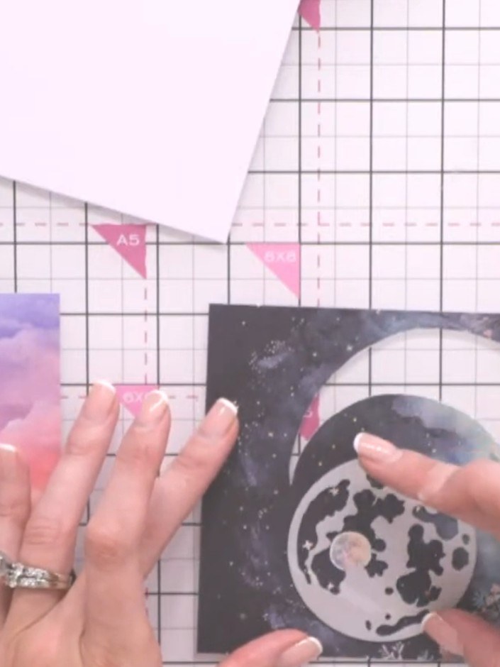 Step 3: Place a piece of scrap cardstock underneath the moon paper. Run it through the die-cutting machine to emboss t