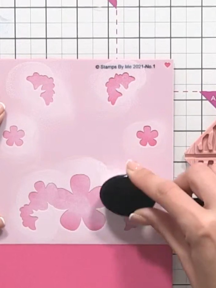 Step 5: Place the third stencil over your card and apply pink ink through it using a blending tool to add colour to th