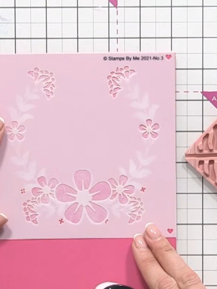Step 6: Position the fourth stencil over your card and apply green ink through it to create the foliage elements of th