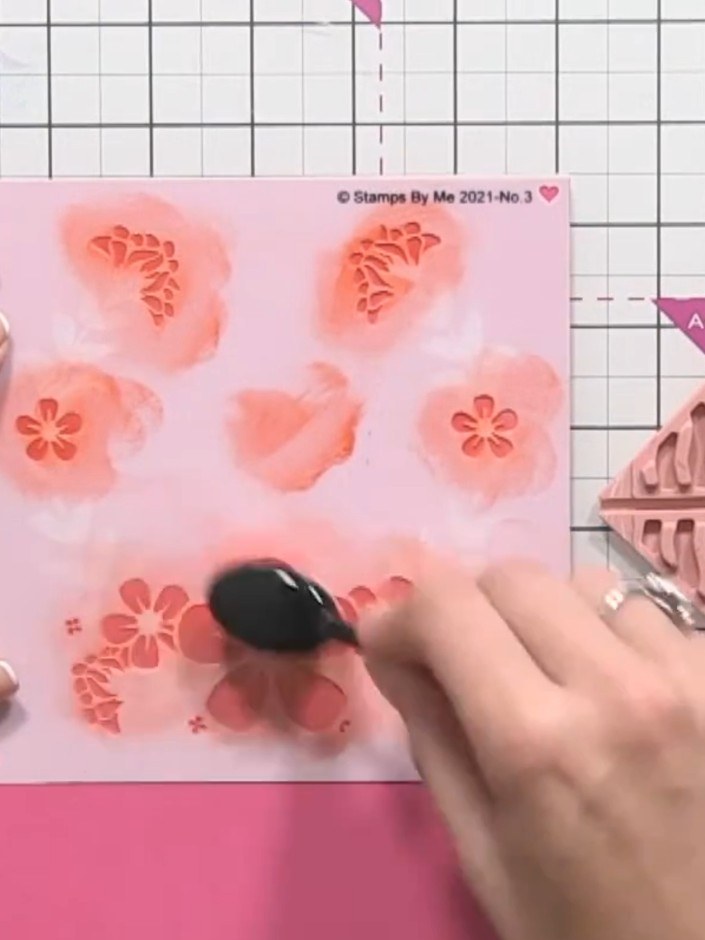 Step 7: If the green appears too dark, clean the stencil and place it back on the card. Apply white ink over the green