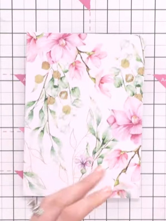 Step 1: Select a card blank from the Magnolia Create a Card Kit. The blank features a beautiful floral design with pin