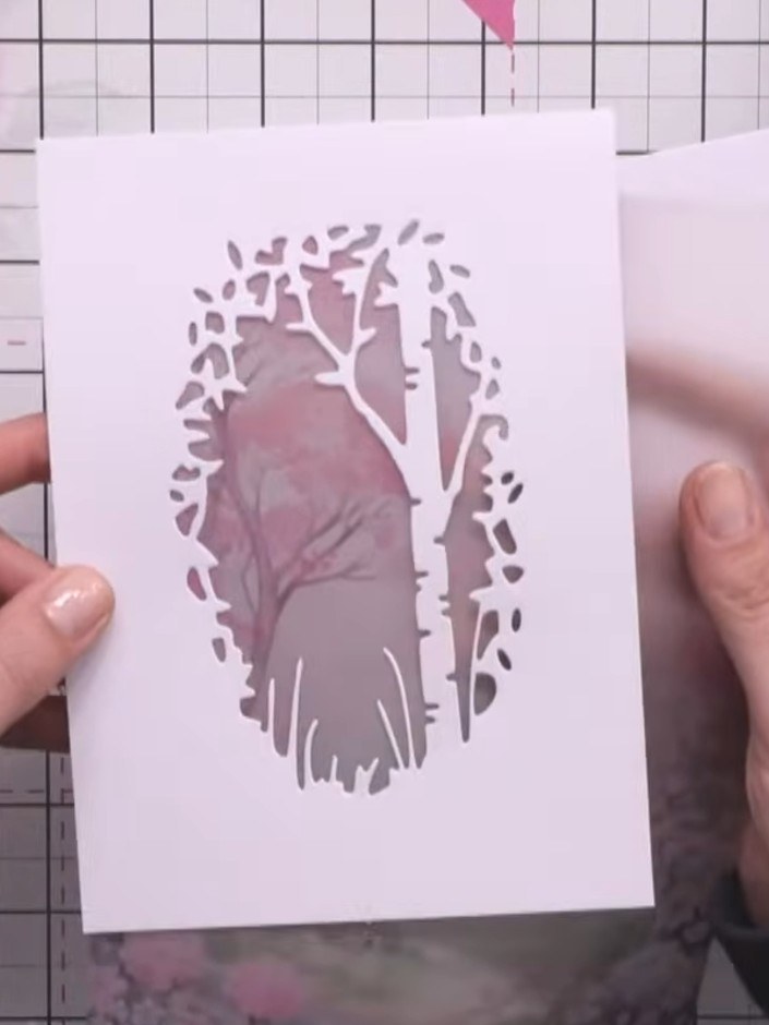 Step 5: Arrange the fussy-cut rabbit and flowers on your card, positioning them to create a natural woodland scene vis