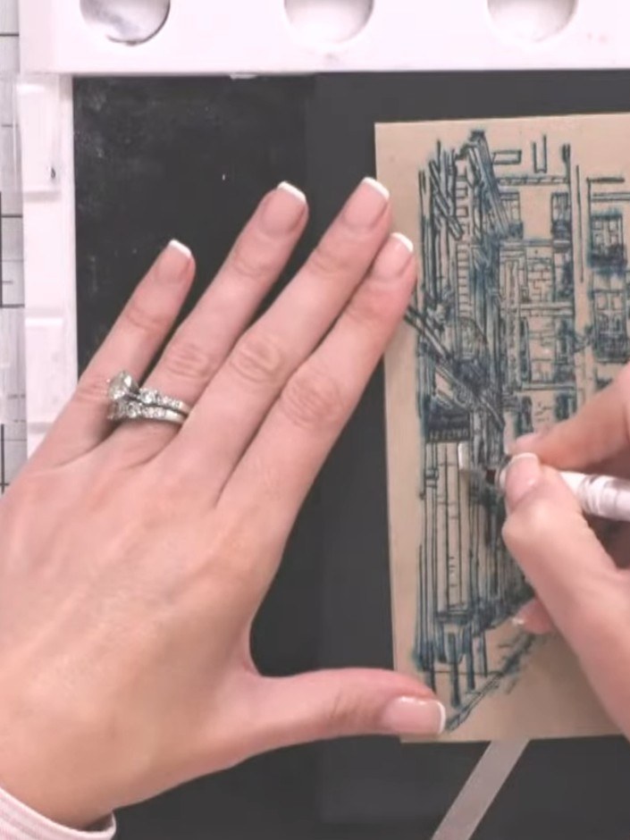 Step 7: Using a white gel pen, add highlights to the stamped image by following the natural lines of the design. Work 