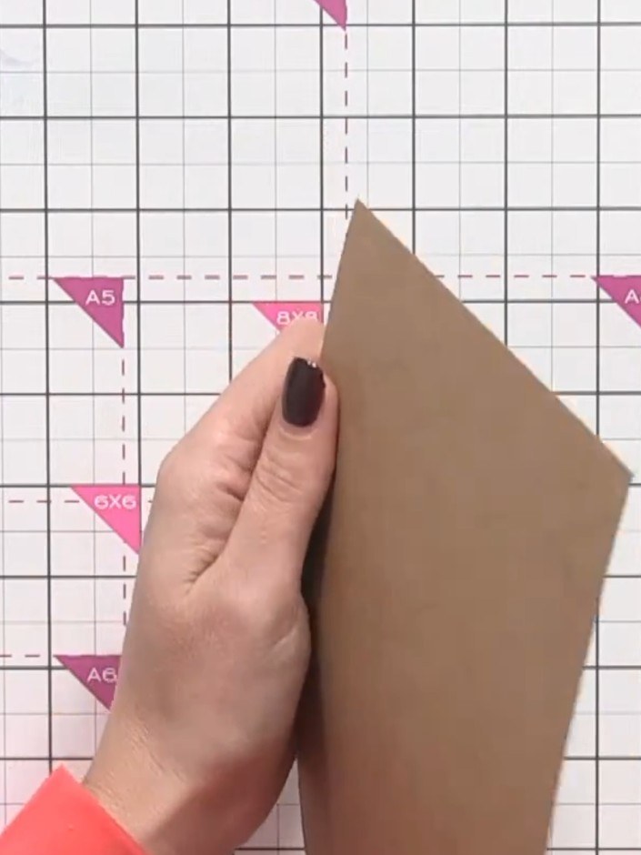 Step 1: Cut a piece of craft-coloured card to fit your A5 embossing folder. This should be slightly smaller than A5 si