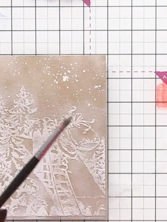 Step 9: Clean your brush with a cloth between colours. Add sparkle or metallic details to Santa's suit cuffs and the r