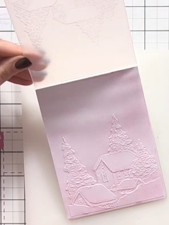 Step 8: Using a dark pink ink, blend colour around the outer edges of the embossed panel to draw the eye towards the c