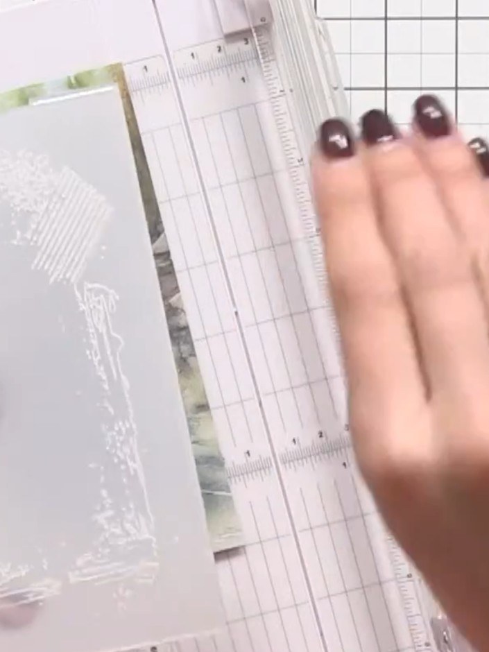 Step 4: Pounce a white ink pad over the entire embossed frame to bring out the snowflake and texture details.