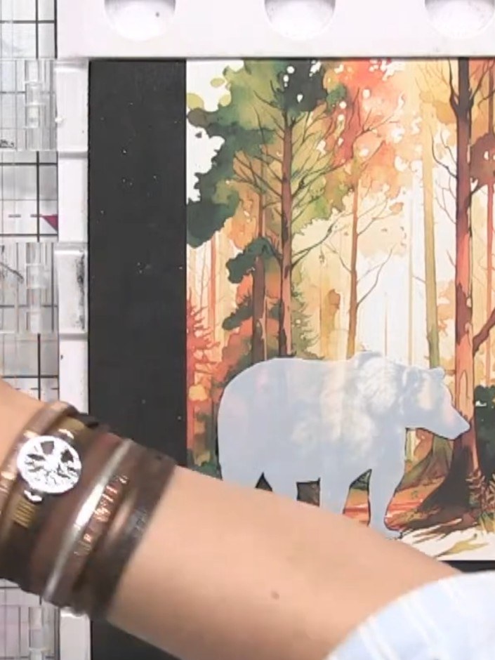 Step 3: Using a small brush, apply white pigment ink around the edges of the bear die-cut to create a soft halo effect