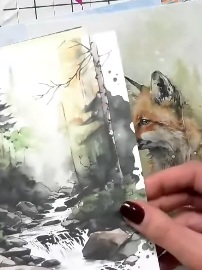 Step 4: Carefully peel away and remove the masking paper to reveal the stamped woodland scene beneath, showing the fox