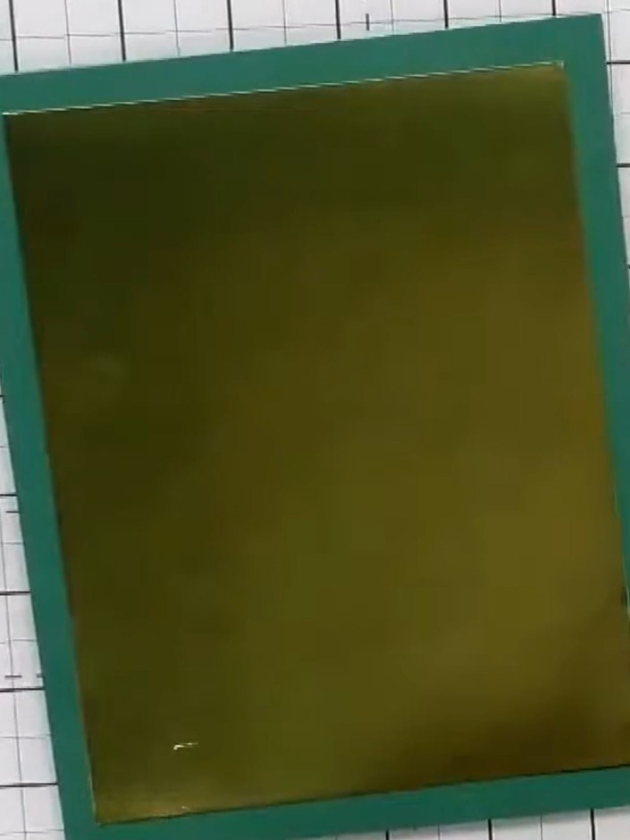 Step 1: Select a teal card blank as your card base. Position a gold metallic panel onto the centre of the card front, 