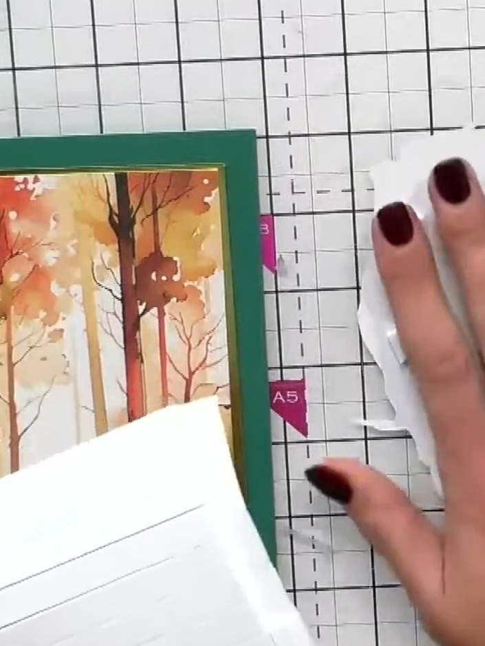Step 4: Mount the white mirror board panel onto the front of your green card base, positioning it centrally.
