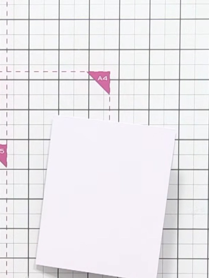 Step 1: Take a larger card blank and position it on your scoreboard. Place the card centrally on the grid to prepare f