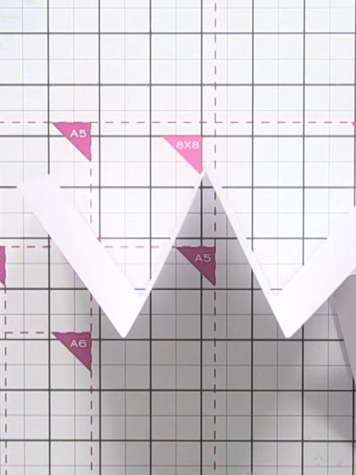 Step 6: Decorate the front panel with card stock pieces, leaving white borders down the sides for visual balance. Posi