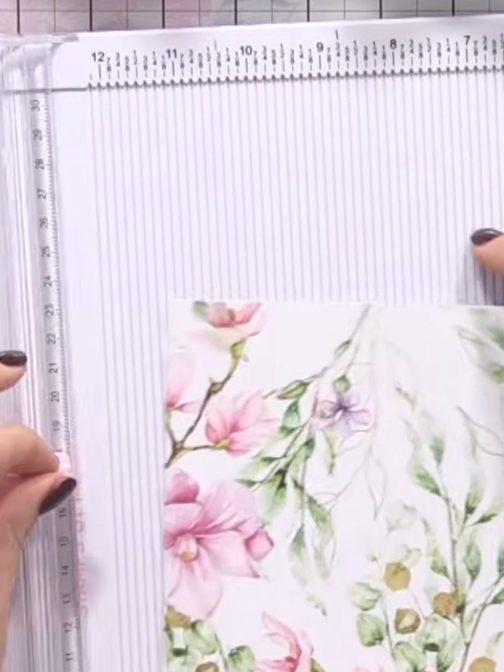 Step 8: Position a coordinating decorative panel on the back of the card. Use adhesive to secure it in place, ensuring
