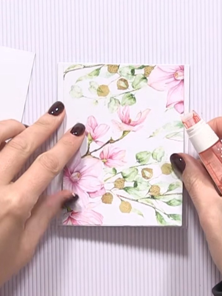 Step 1: Take a standard white card blank and trim decorative panels from the floral patterned card stock. Use your tri