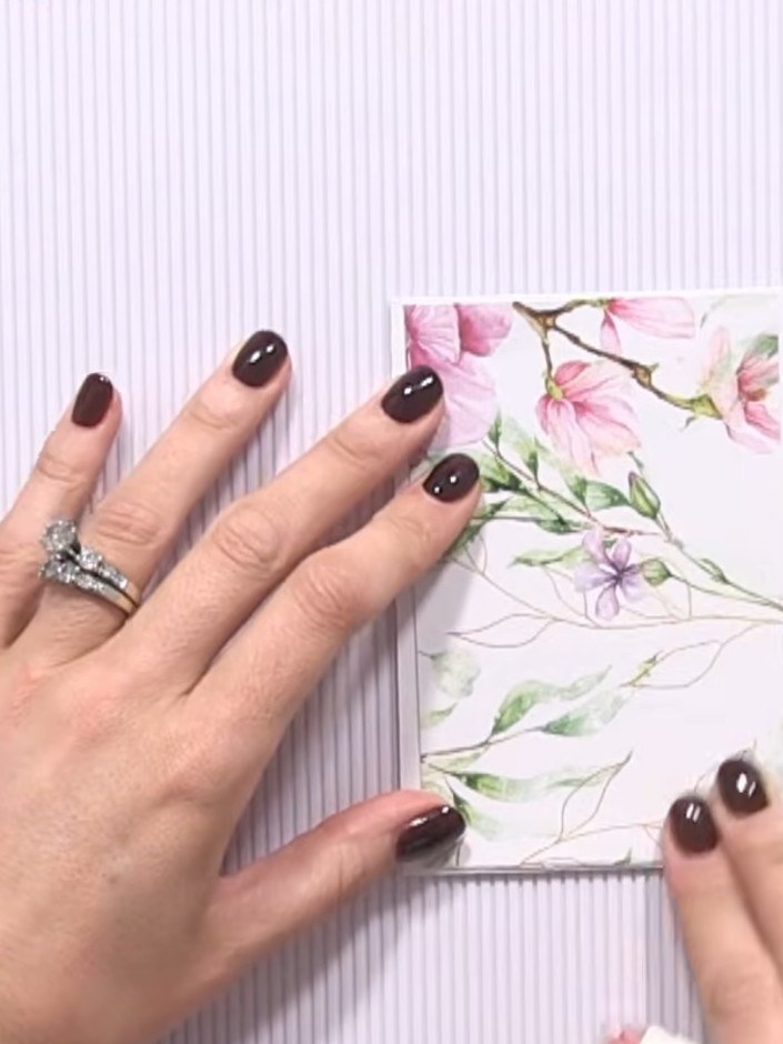 Step 2: Cut panels from your chosen decorative paper to fit down the sides of your card base. Leave a white border vis