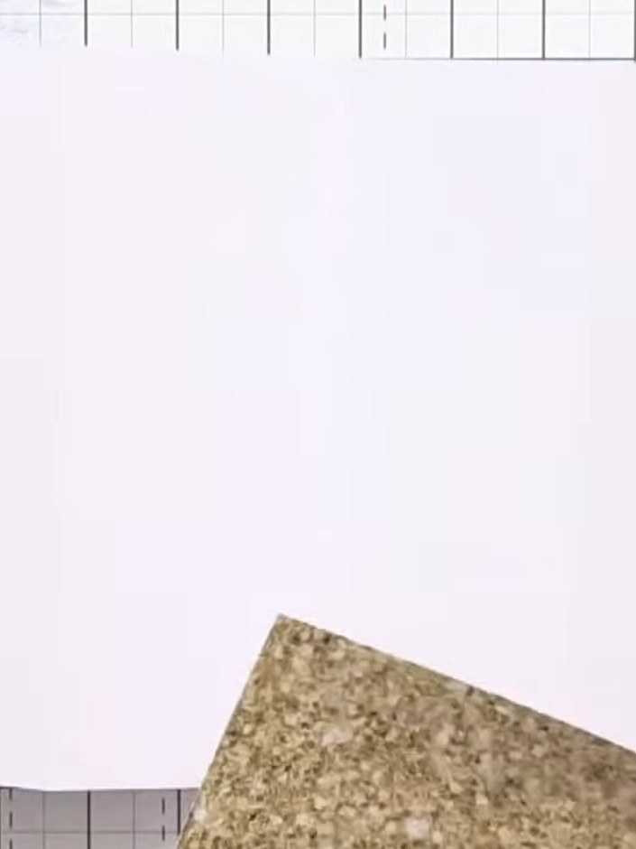 Step 4: Position and adhere a second decorative panel with a different pattern on the opposite side of the card base t