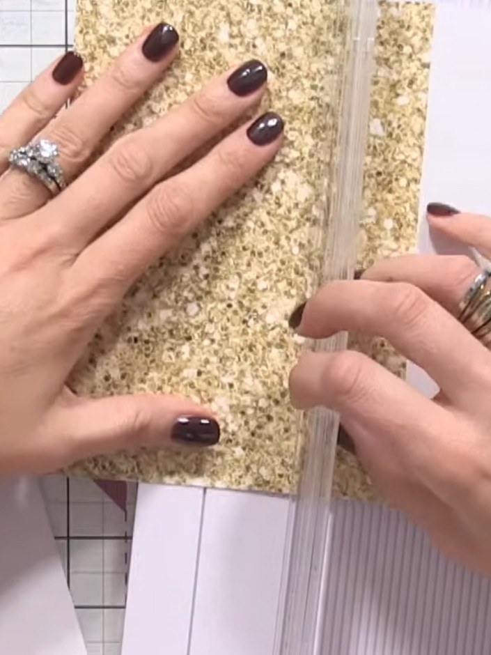 Step 7: Position your glittery embellishment panels on the white card base. Use the grid lines on your cutting mat to 